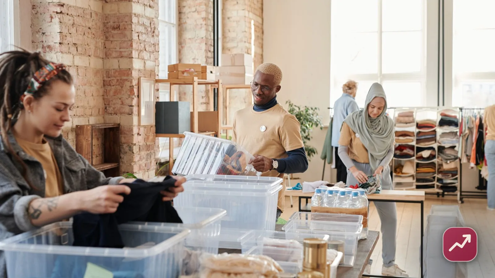 Volunteers sorting donated goods at a charity drive, illustrating tax-deductible charitable giving.